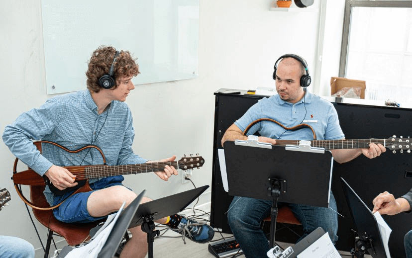 Group guitar lesson in progress at Boston Music School